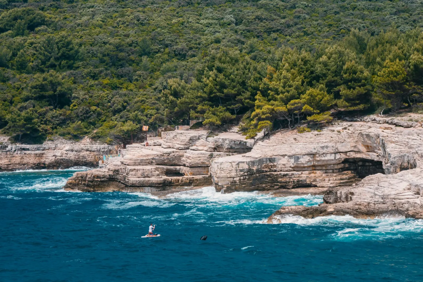 The wild cliffs and clear water of Cape Kamenjak